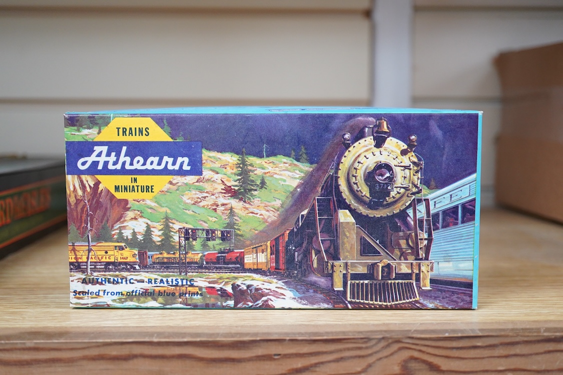 A quantity of US outline HO railway by Athearn, Bachmann, etc. including three locomotives; a Union Pacific Bo-Bo diesel, 1468, a Santa Fe Bo-Bo diesel, 5707, and a Santa Fe 0-4-0 tender engine, together with a 12-wheel